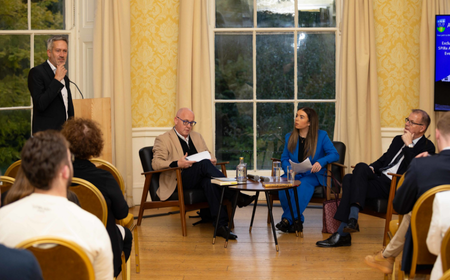 Person speaking during the event for SPIRe alumni at MoLI.